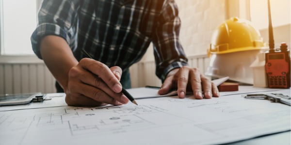 A commercial architect going over some drawings.