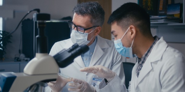 Two developmental biologists doing research.