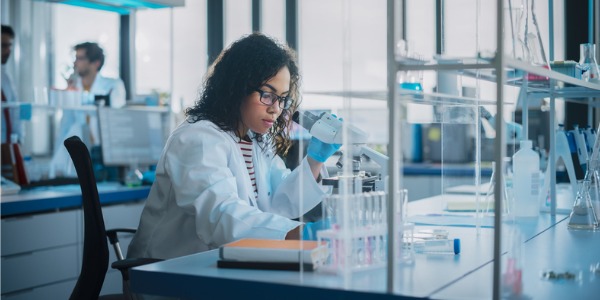 A systems biologist working in the lab.