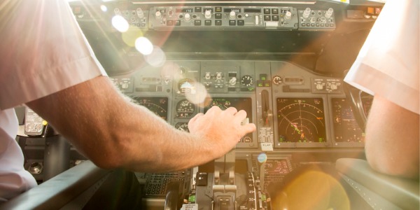A commercial pilot in the cockpit.