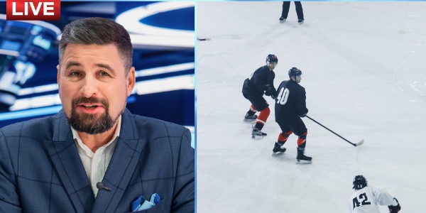 A radio announcer commenting on the hockey game in progress.