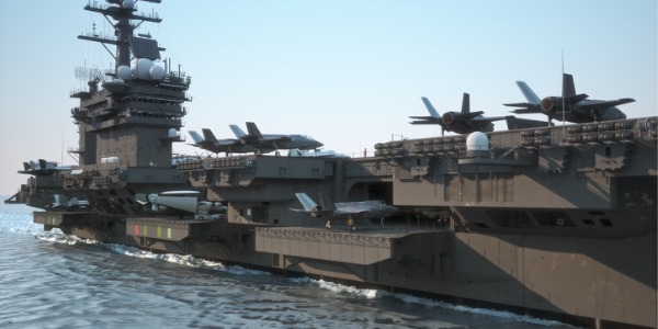Aircraft on an aircraft carrier deck of a naval ship.
