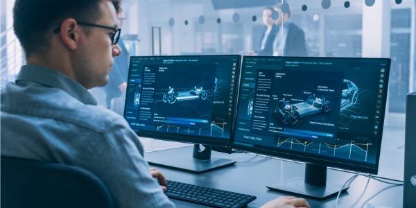 An automotive engineer working on his computer.