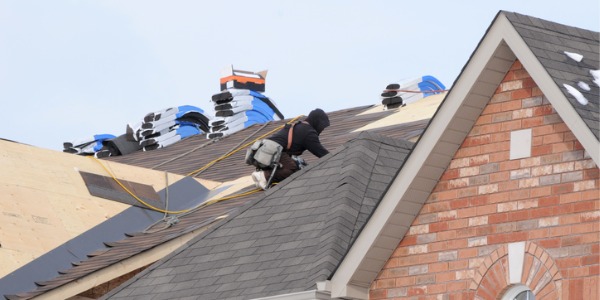 A roofer working on a roof.