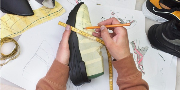 An athletic shoemaker designing a running shoe.