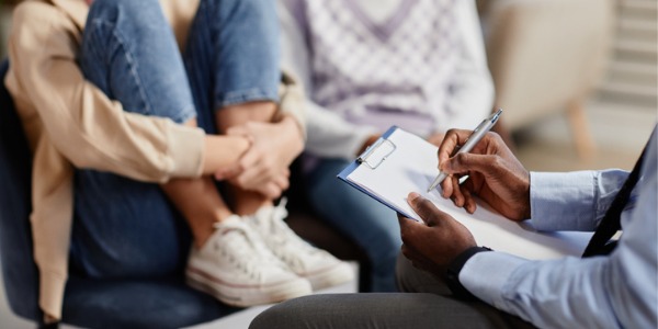 A family social worker conducting an assessment.