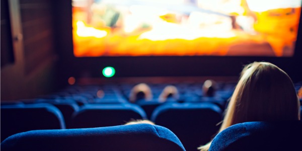 A movie playing in a theatre.