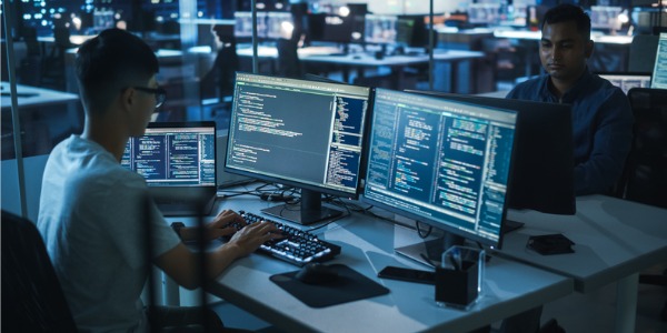 A red teamer working on his computer.