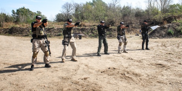 Army officers practicing gun shooting.
