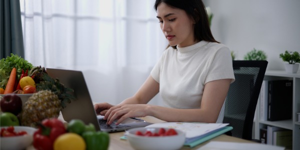 A registered dietitian sitting at her desk.