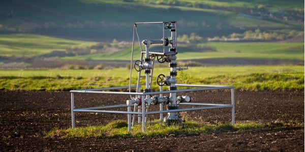 A natural gas wellhead out in the field.