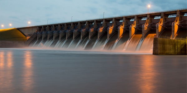 The Keystone dam in Oklahoma with all the gates open and flowing a lot of water. .