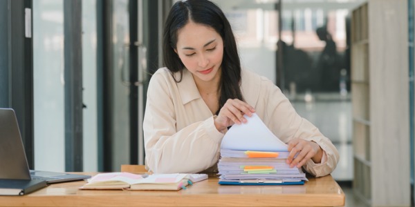 A judicial law clerk looking through client files.
