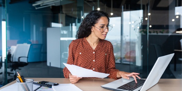 An insurance appraiser working at her desk.