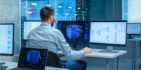 An artificial intelligence engineer working on his computer.