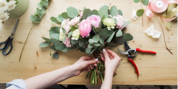 A florist making an arrangement.