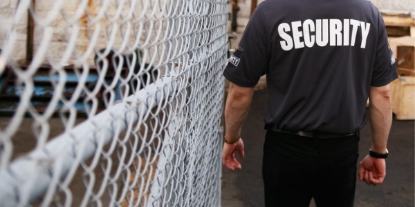 A security guard outside, watching for any suspicious activity.