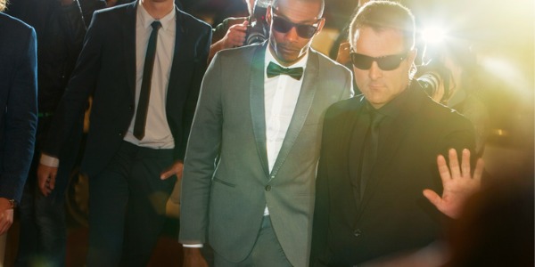 A bodyguard looking out for the personal security of their client.