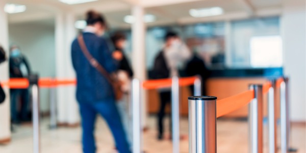 A bank patron waiting in line to see a teller.