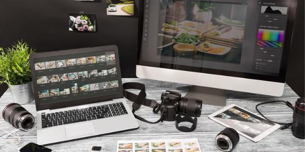 A commercial photographer's computer with photo edit programs.