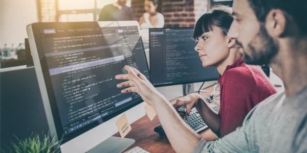 Two web application developers designing a web-based application.