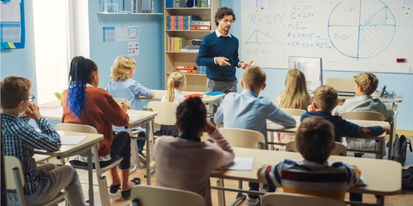 A middle school teacher teaching a class.