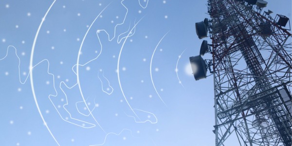 An image of a telecommunication tower and TV antennas, depicting wireless technology and the work of radio frequency specialists.