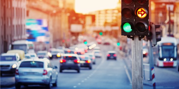 Cars moving on the road in a city.