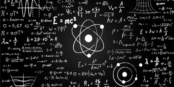 Blackboard inscribed with scientific formulas and calculations in physics and mathematics.