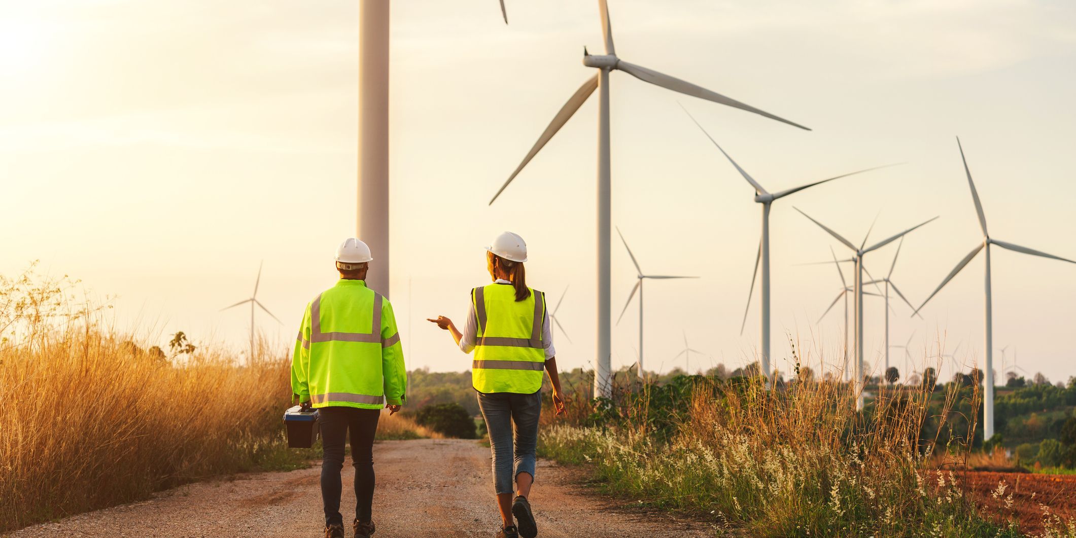 Two wind energy engineers out in the field.