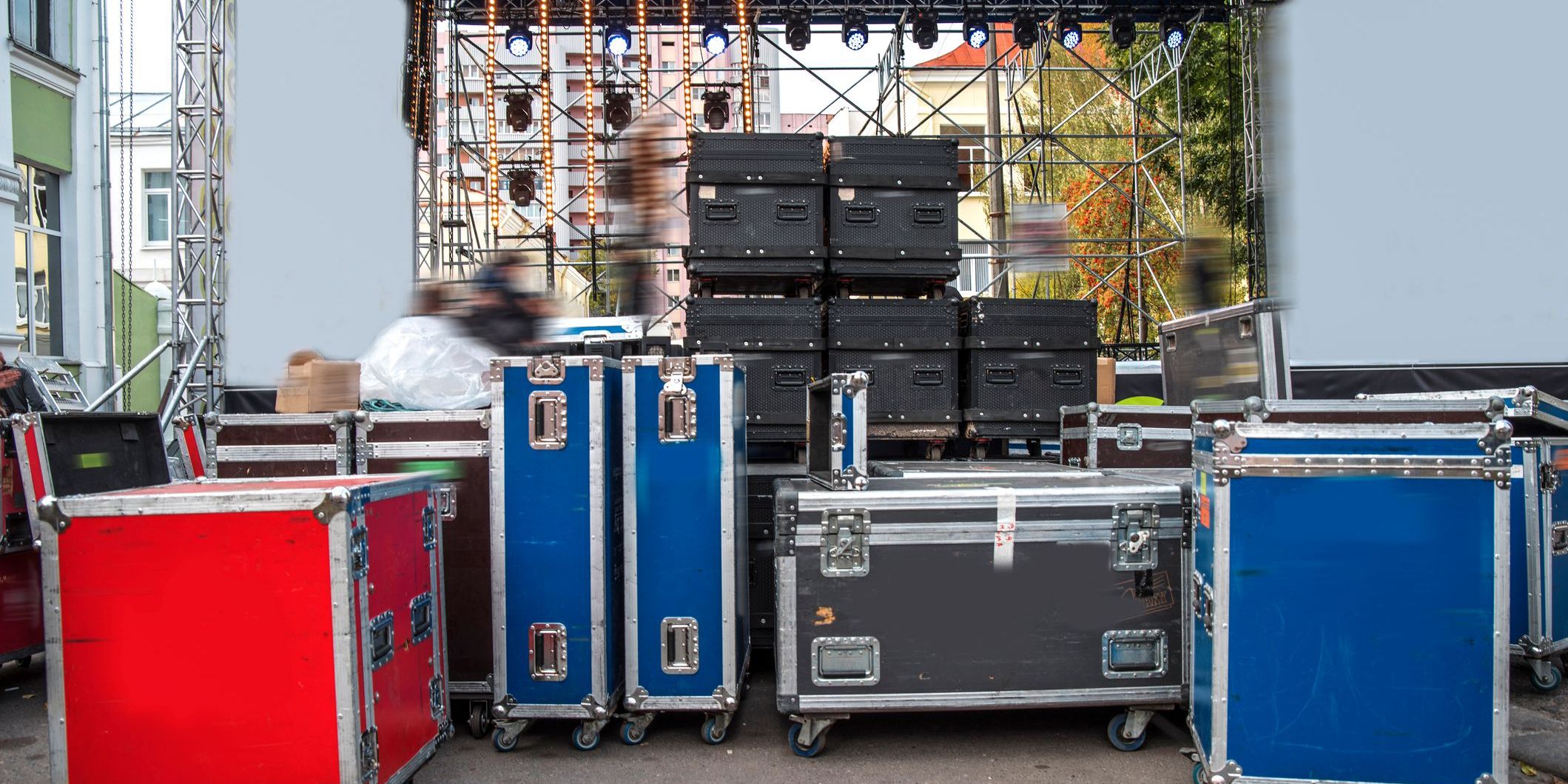 Concert stage equipment at a concert location, organized by a road manager.