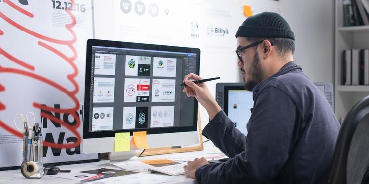 A desktop publisher working on a layout.