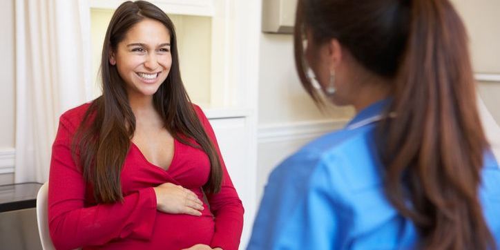 An obstetric nurse with a patient.