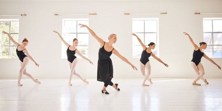 A ballet choreographer working with ballet dancers.
