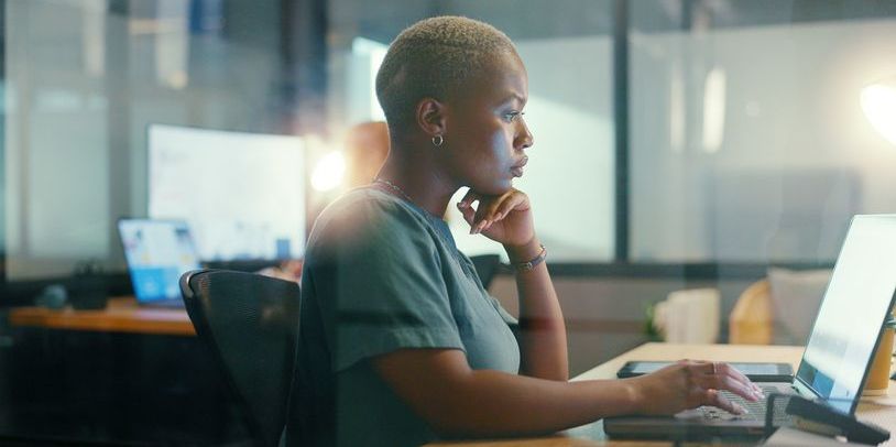 A digital banking specialist working on her computer.