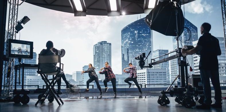 A choreographed dance for TV being filmed.
