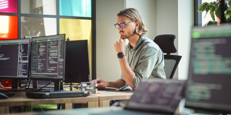 An E-Learning developer working on his computer.