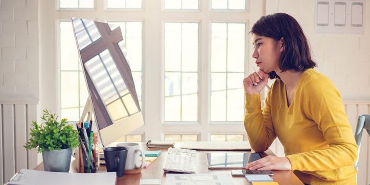 A learning experience designer working on her computer.