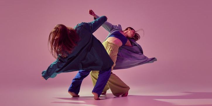 Two dancers executing a dance choreographed by an experimental choreographer.