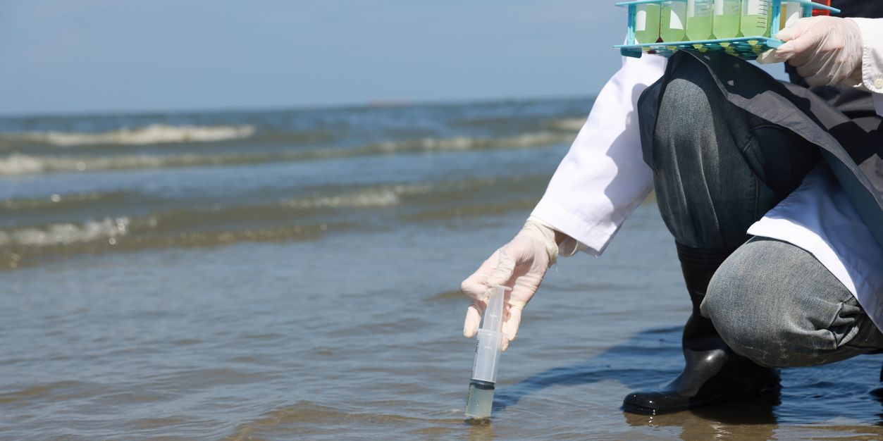 A marine microbiologist collecting seawater samples.