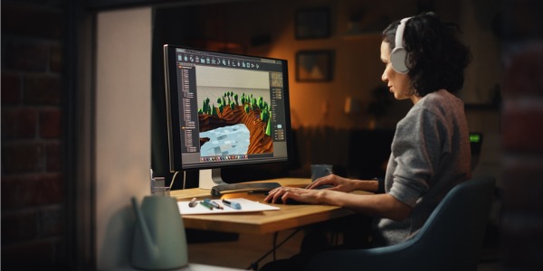 A game level designer working on her computer.