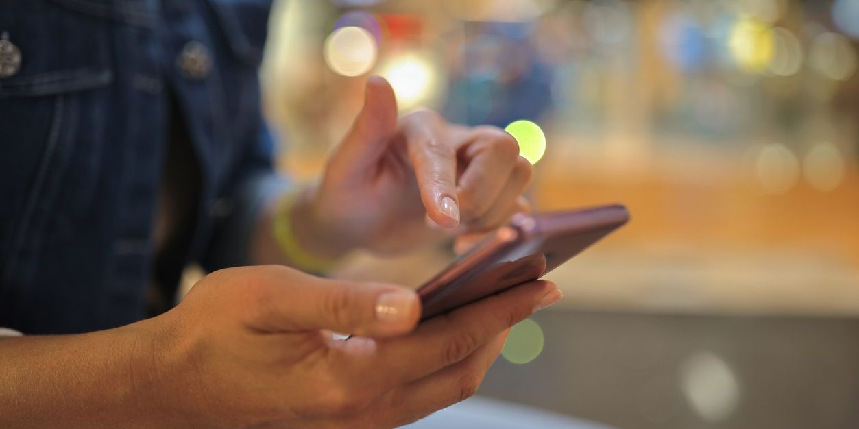 A woman using an Android phone.