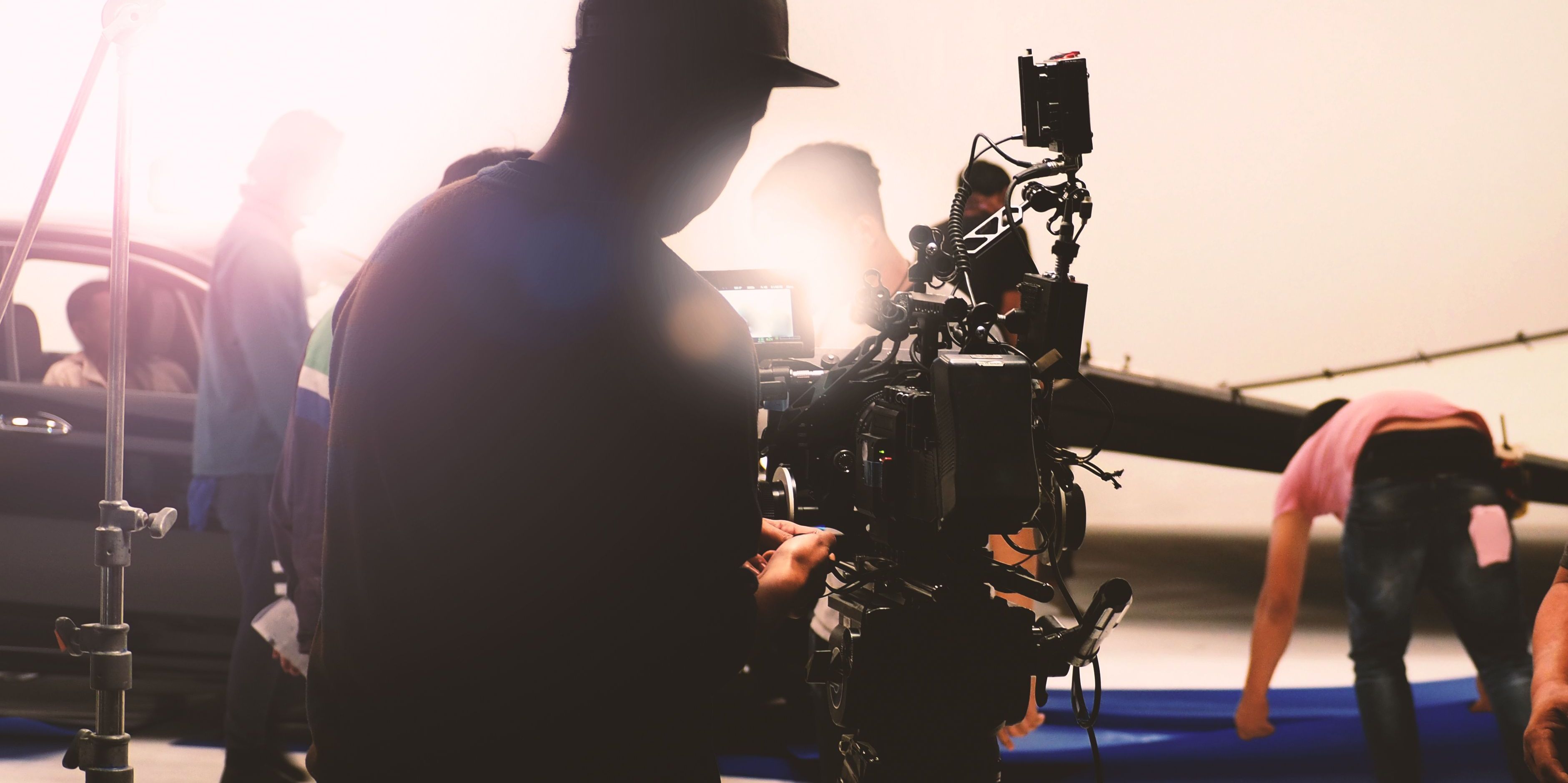 A commercial filmmaker behind the camera during the filming of an advertisement.