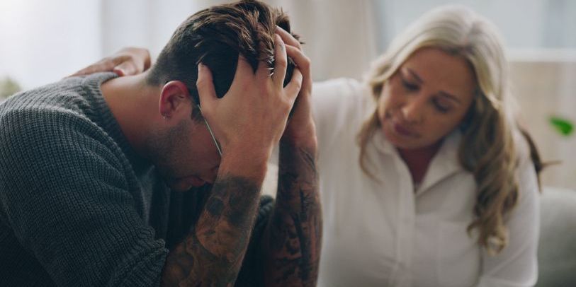 A crisis intervention specialist providing emotional support to an individual in distress.