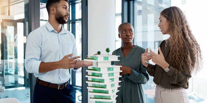 A real estate investment agent helping a client identify an investment opportunity.