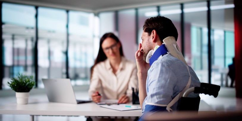 A personal injury lawyer talking to her injured client.