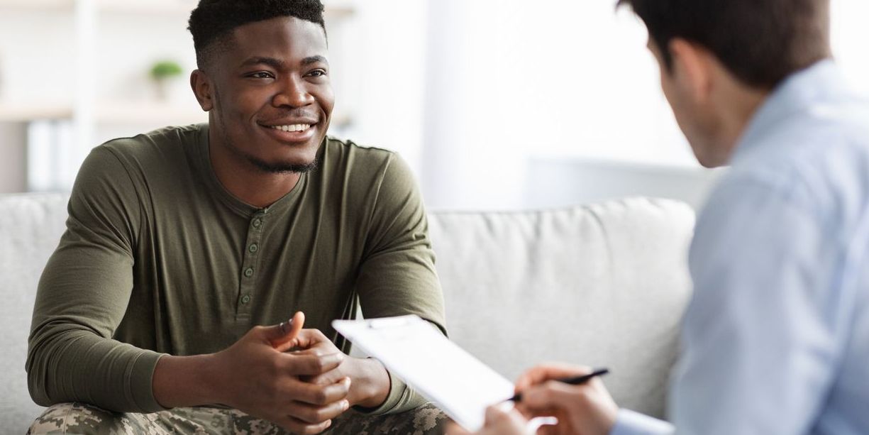 A military career counselor helping a service member with his long-term career plans.