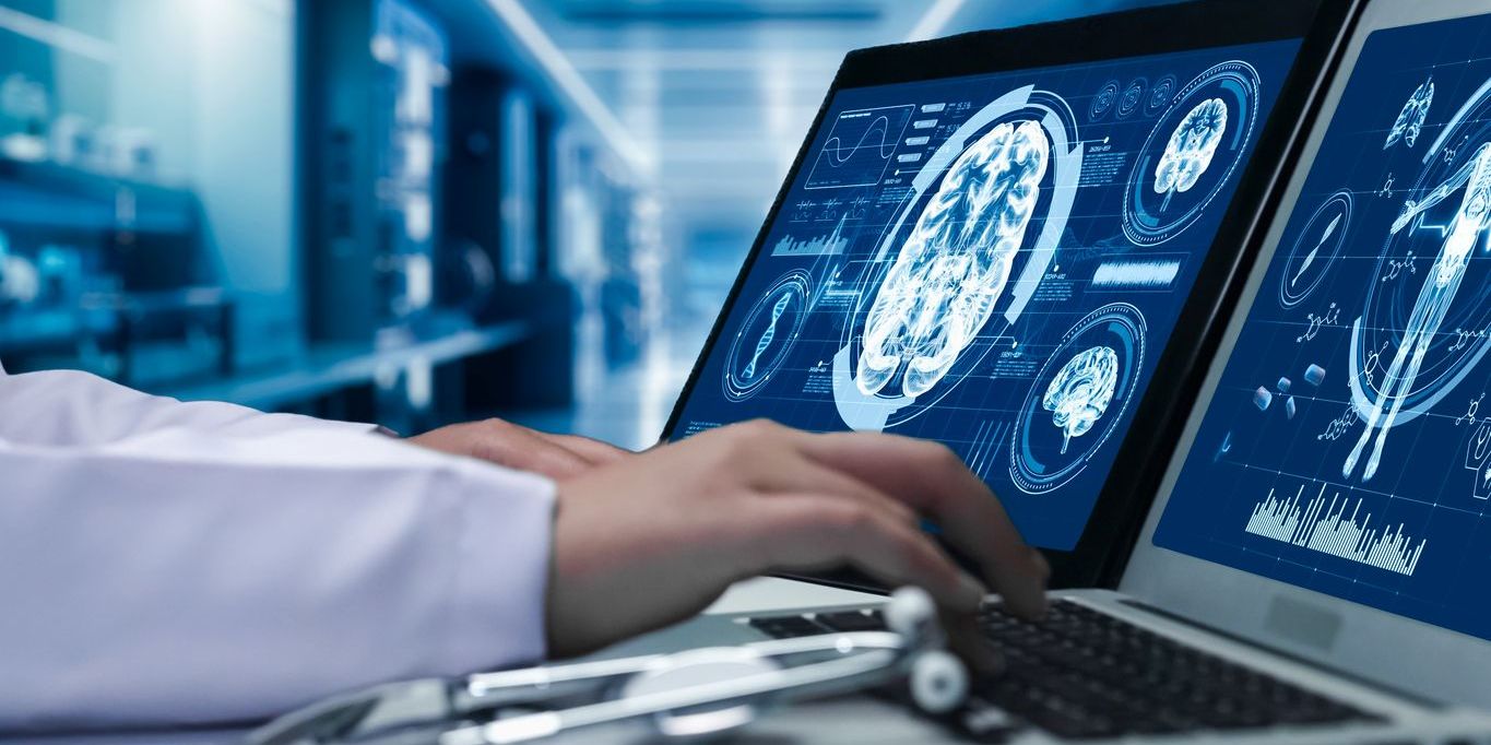 A psychobiologist examining brain images.