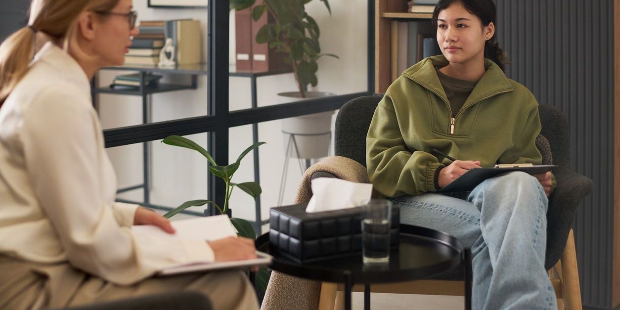 A clinical social worker conducting an interview with a client.