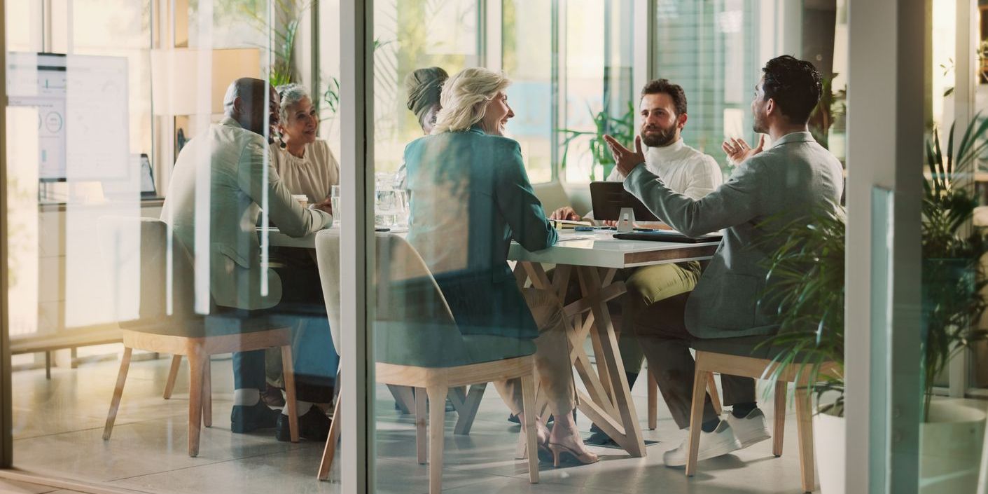 A city manager having a meeting with several heads of departments.